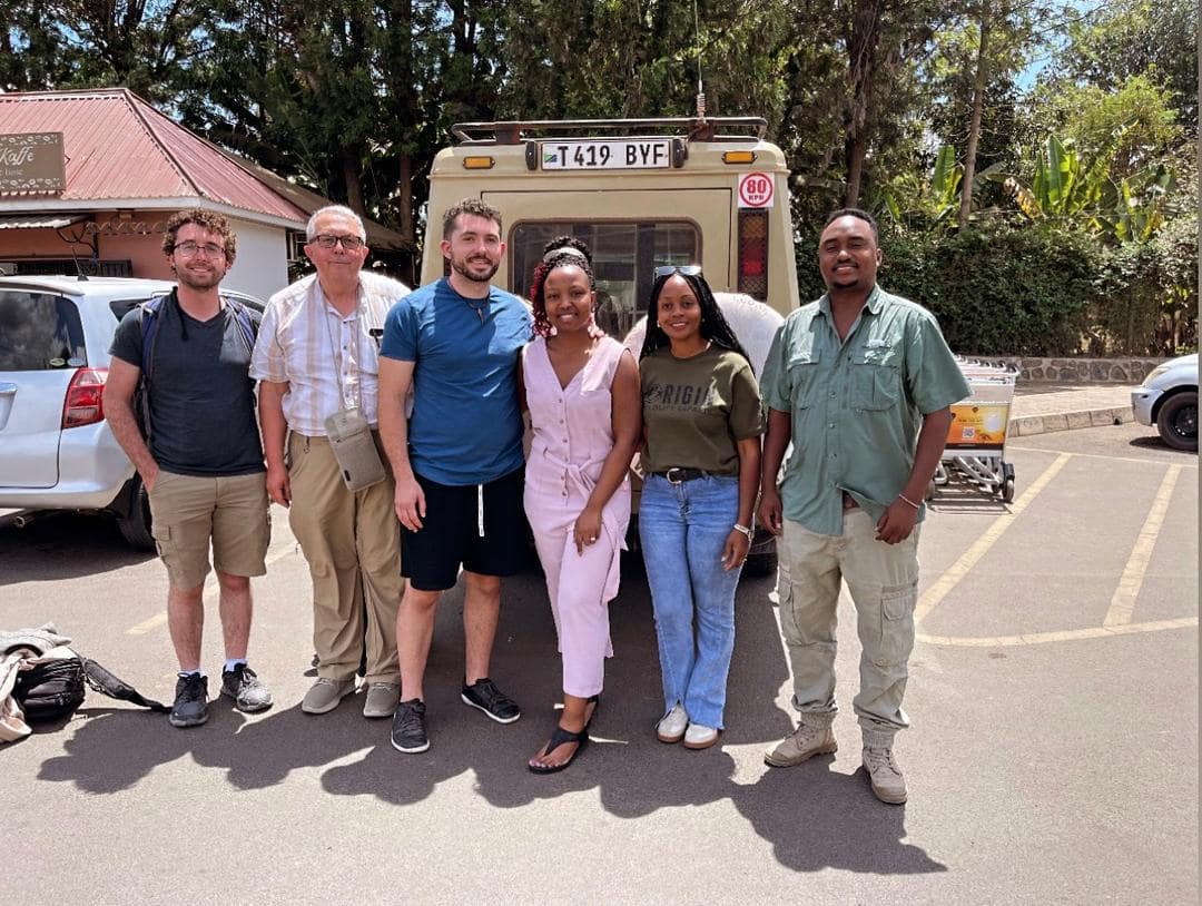 Family en-route for Serengeti great wilderbeest migration in Tanzania
